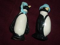 Penguins with blue bonnets